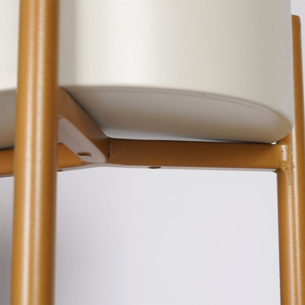 Stylish metal pot on stand in cream white and gold