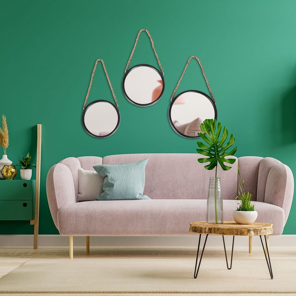 Stylish wall mirrors with black frames and natural rope
