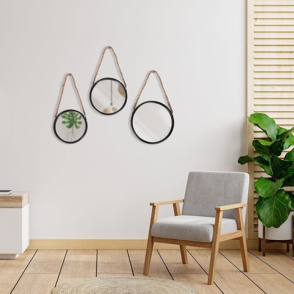 Stylish wall mirrors with black frames and natural rope