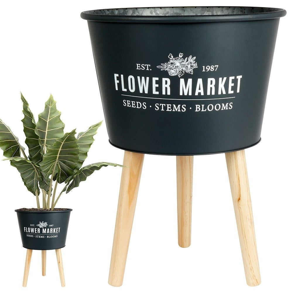Stylish zinc pot on three legs in graphite color with text