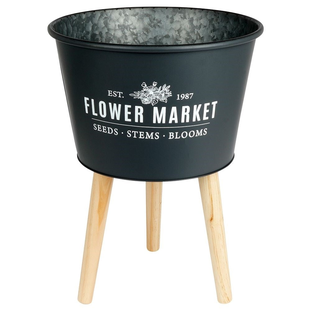 Stylish zinc pot on three legs in graphite color with text