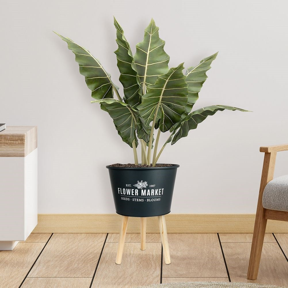 Stylish zinc pot on three legs in graphite color with text