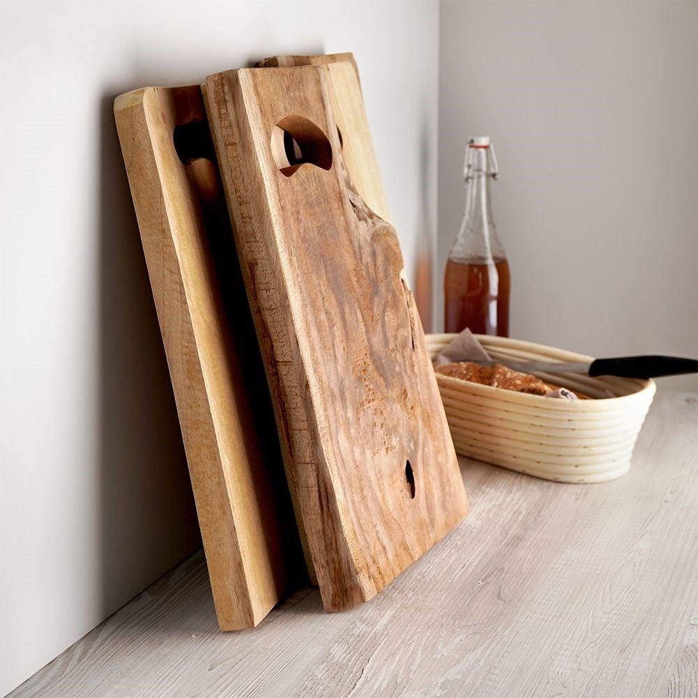 Teak wood cutting board with handle and antibacterial properties