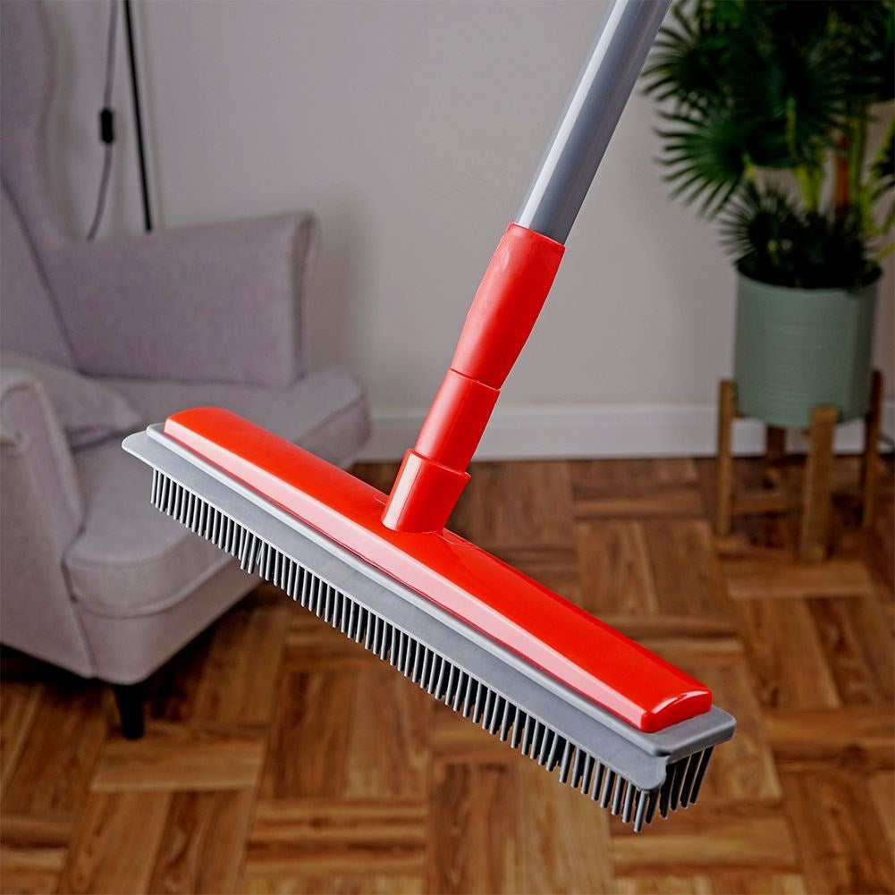 Telescopic broom with rubber brushes and water scraper