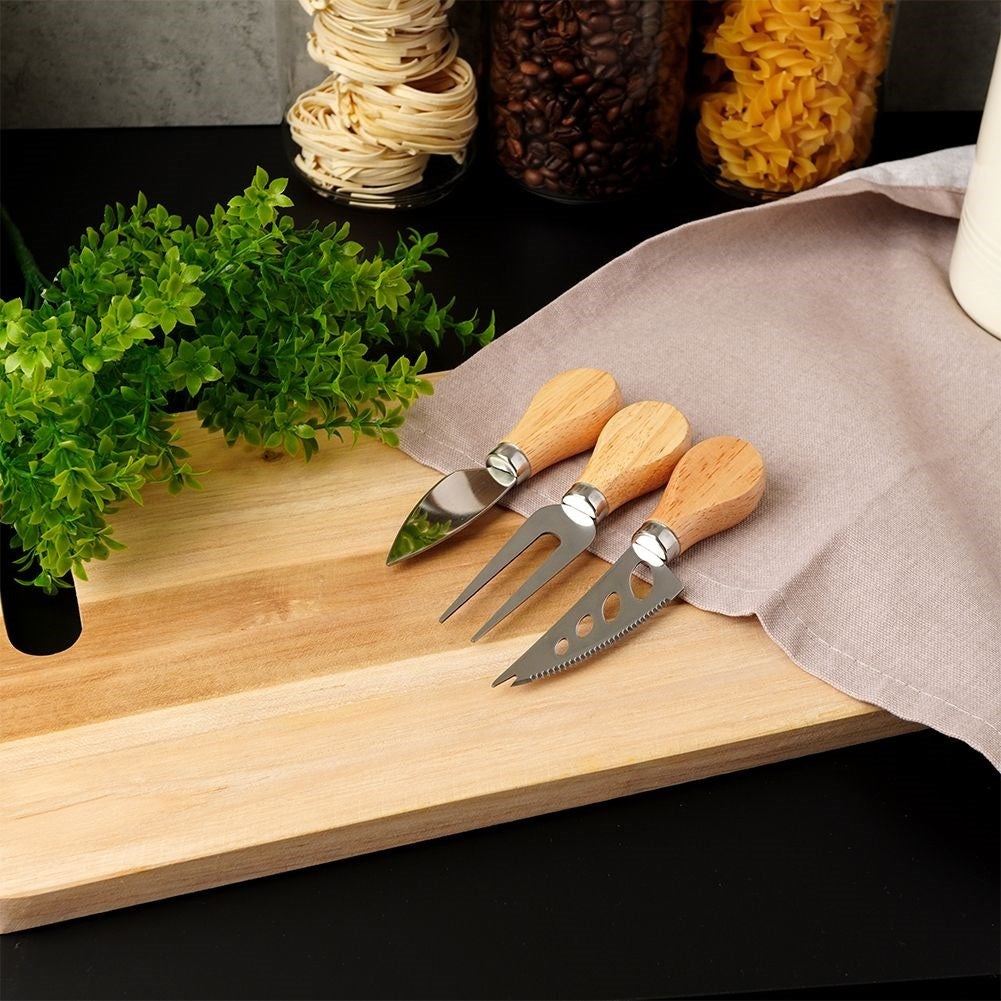 The cheese accessory set: 3 parts in stainless steel and rubber wood