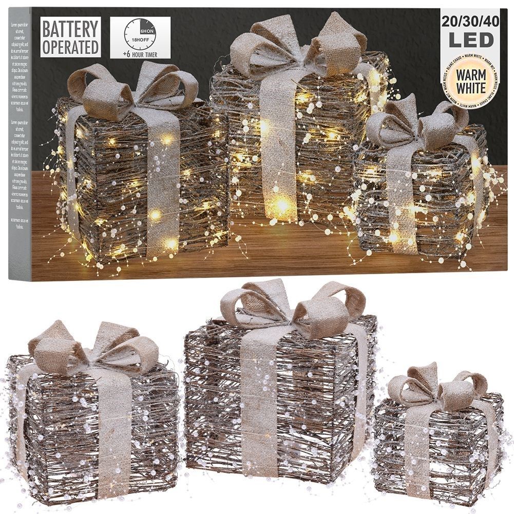Three Christmas gifts with bright LED diodes and pearl color