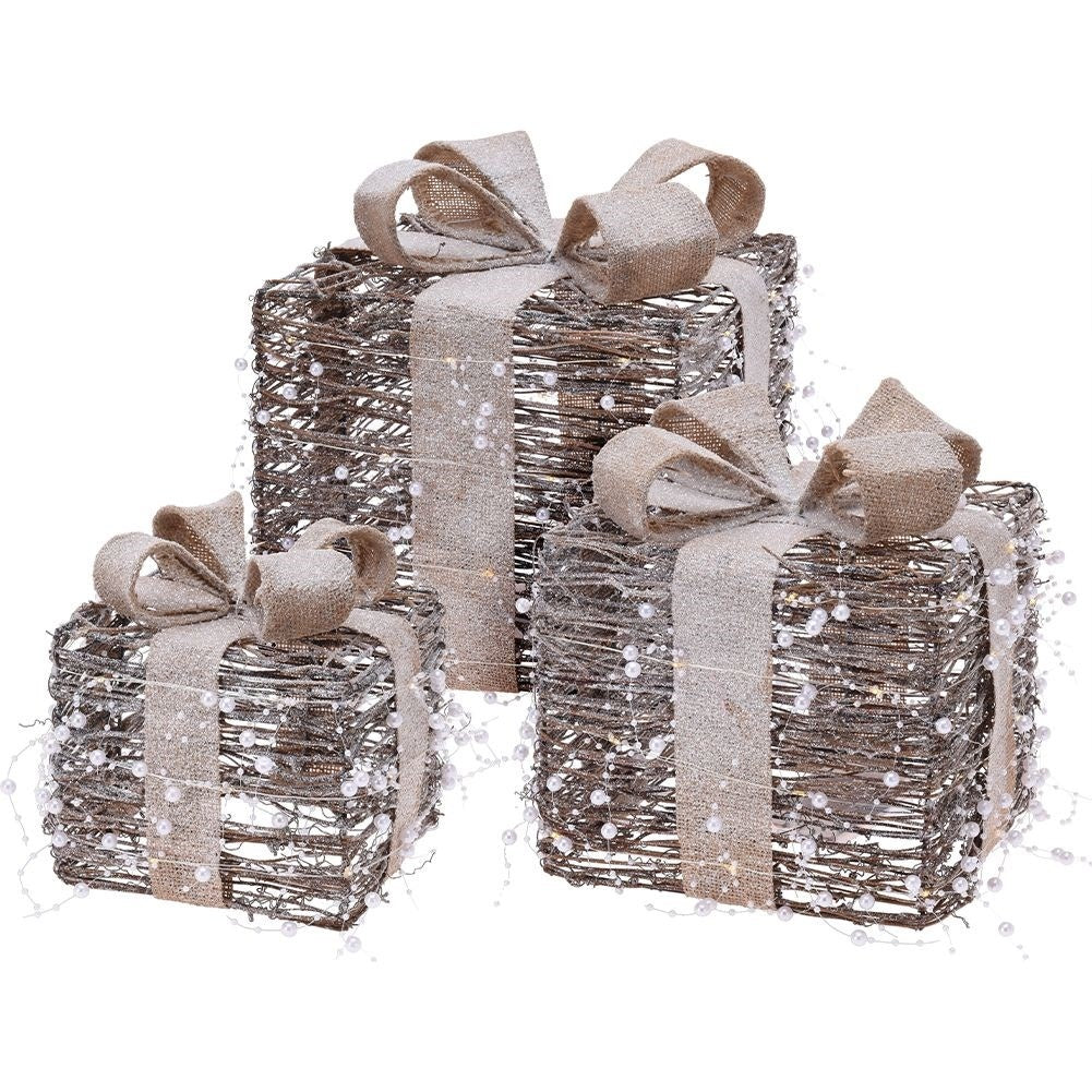 Three Christmas gifts with bright LED diodes and pearl color
