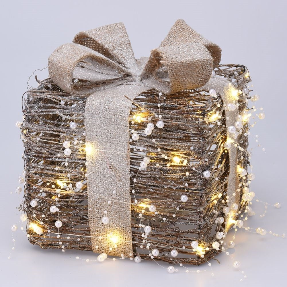Three Christmas gifts with bright LED diodes and pearl color