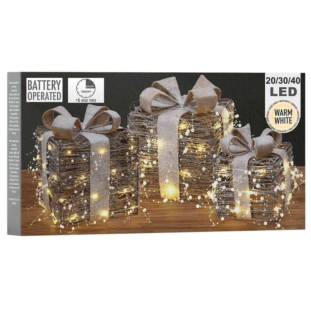 Three Christmas gifts with bright LED diodes and pearl color