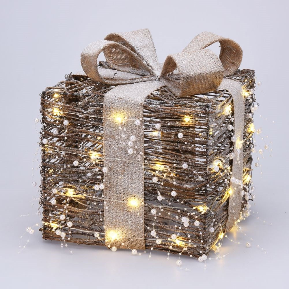 Three Christmas gifts with bright LED diodes and pearl color