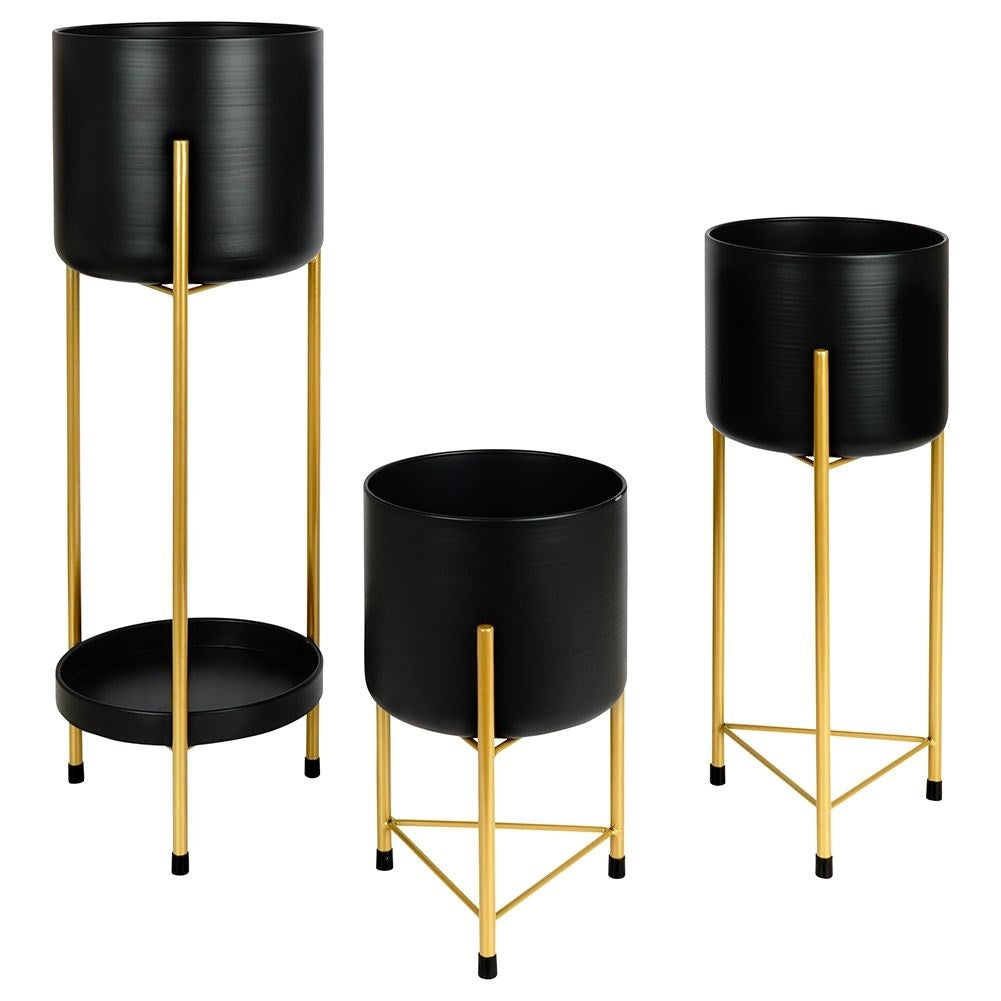 Three black flower pots on gold stand for elegant plant display