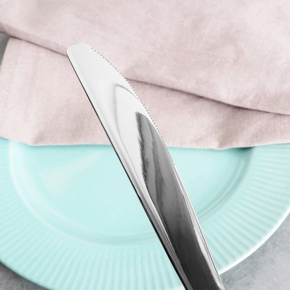 Three dinner knives in stainless steel with a hammered effect