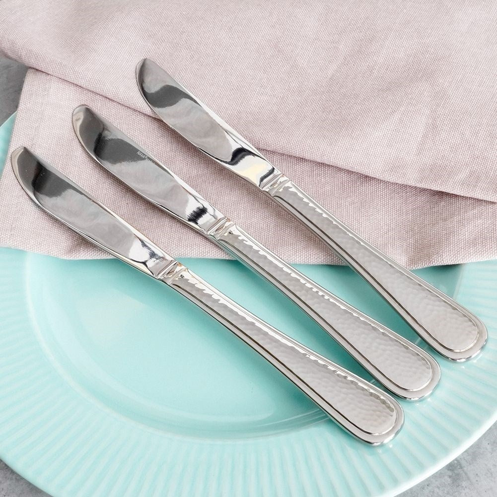 Three dinner knives in stainless steel with a hammered effect