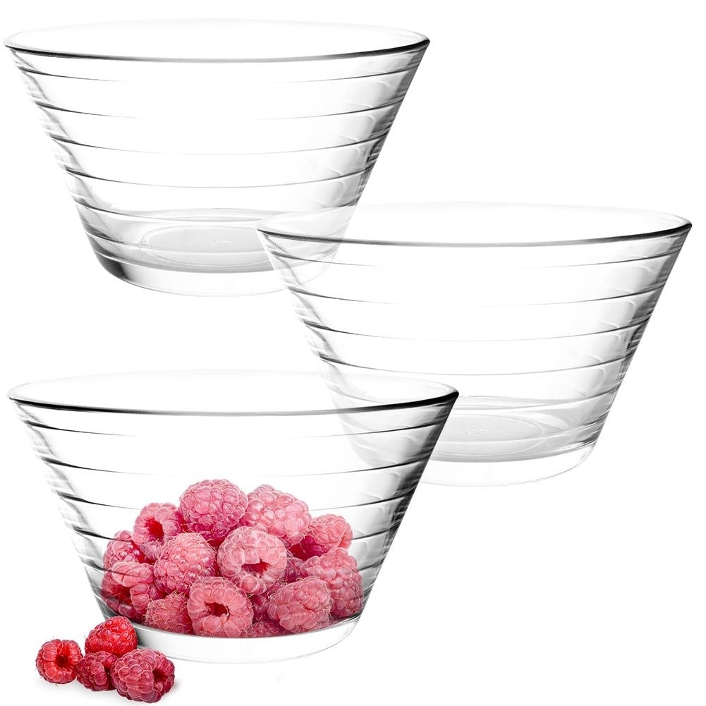 Three elegant glass bowls for salad, snacks and dessert