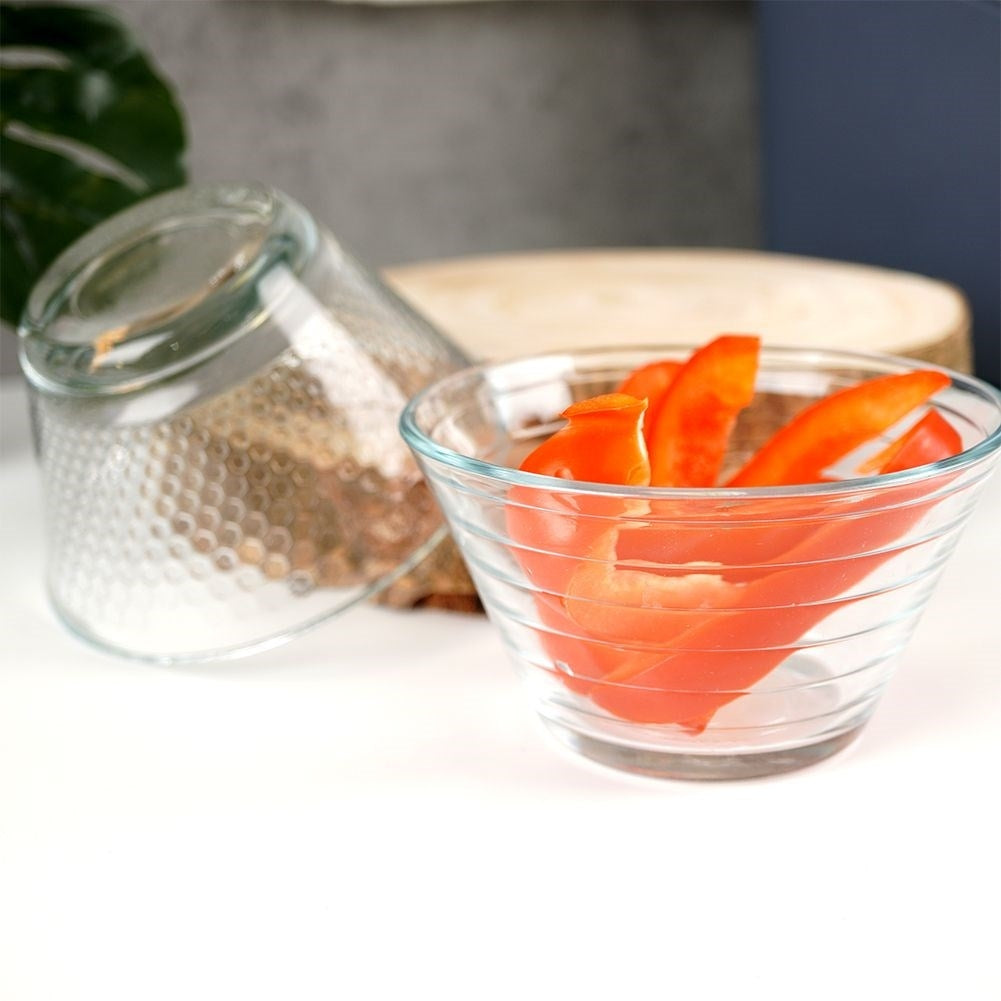 Three elegant glass bowls for salad, snacks and dessert