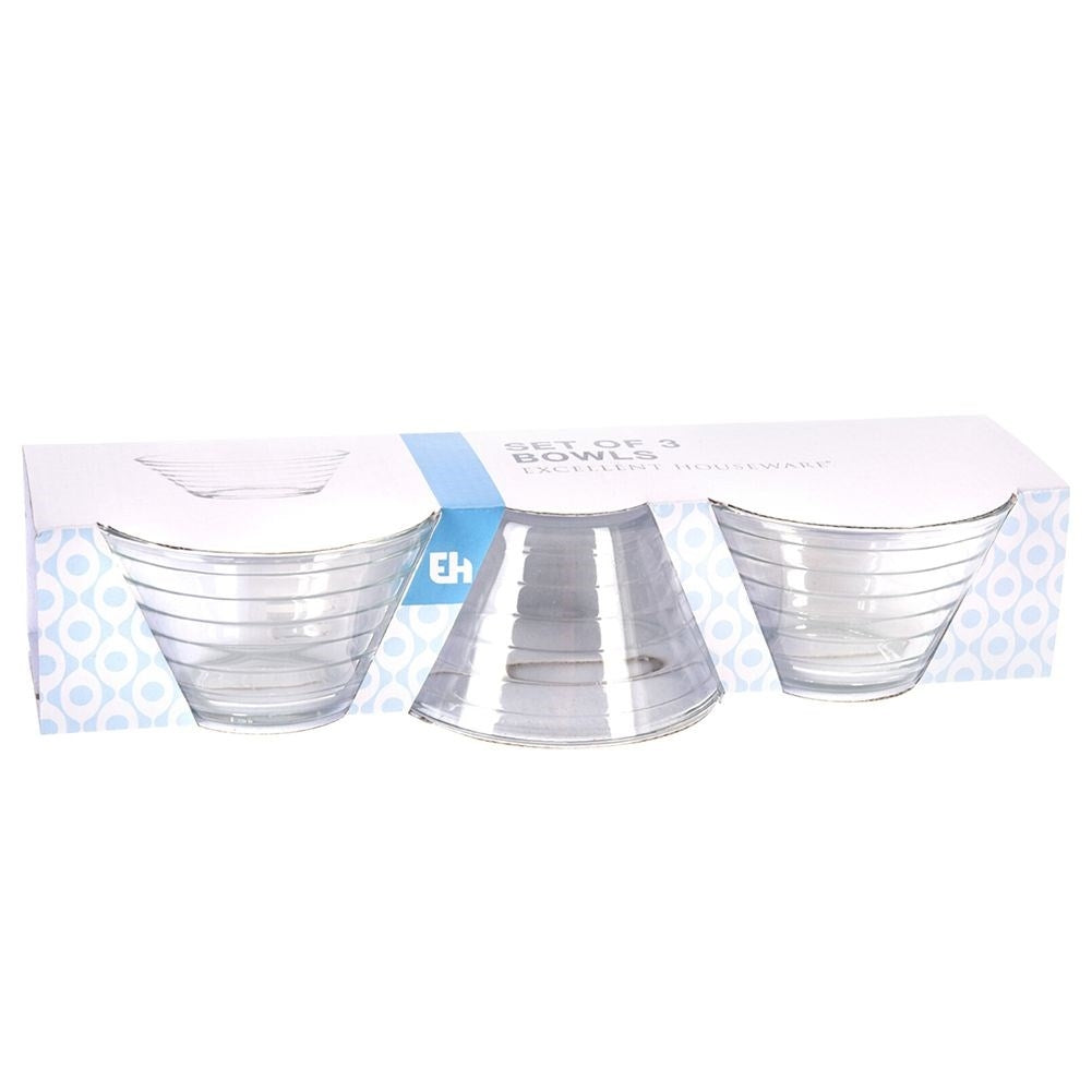 Three elegant glass bowls for salad, snacks and dessert