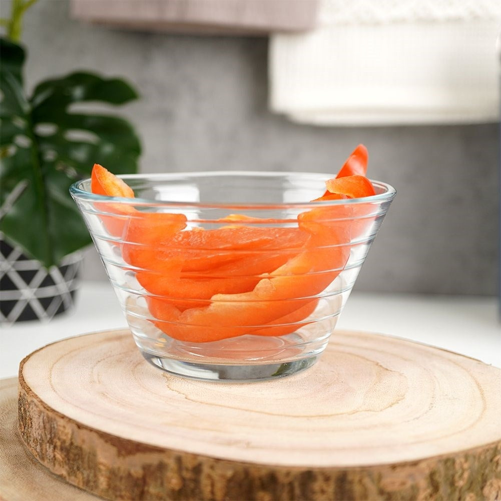 Three elegant glass bowls for salad, snacks and dessert