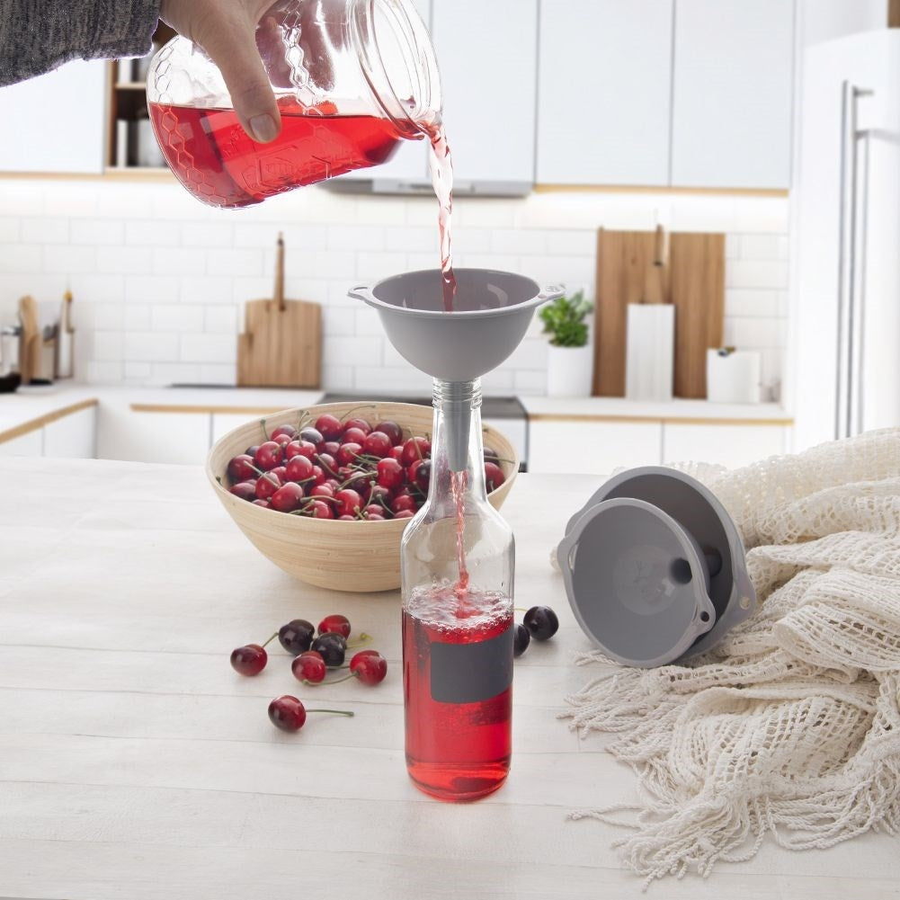 Three kitchen funnels in different sizes, transparent material