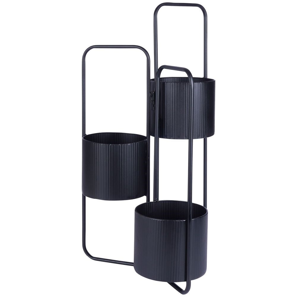 Three-legged flower stand in black metal for indoor use