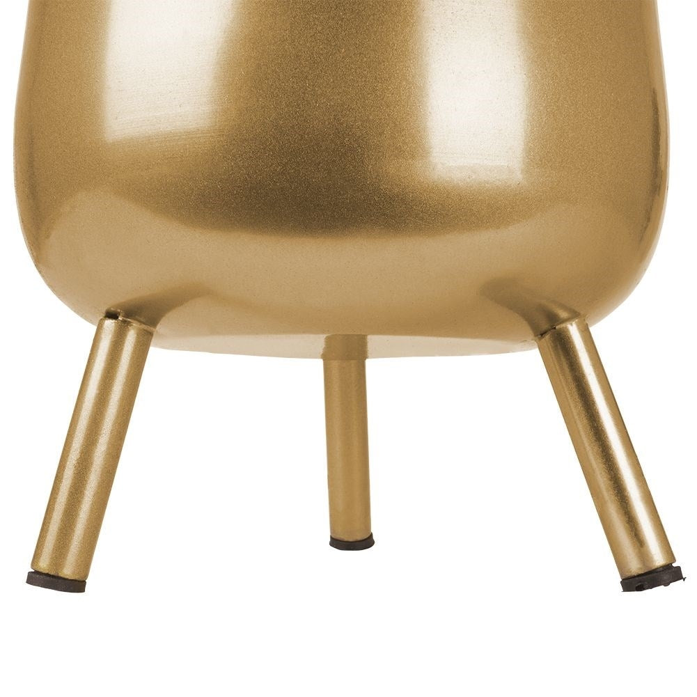 Three-legged pot in golden metal with non-slip coating