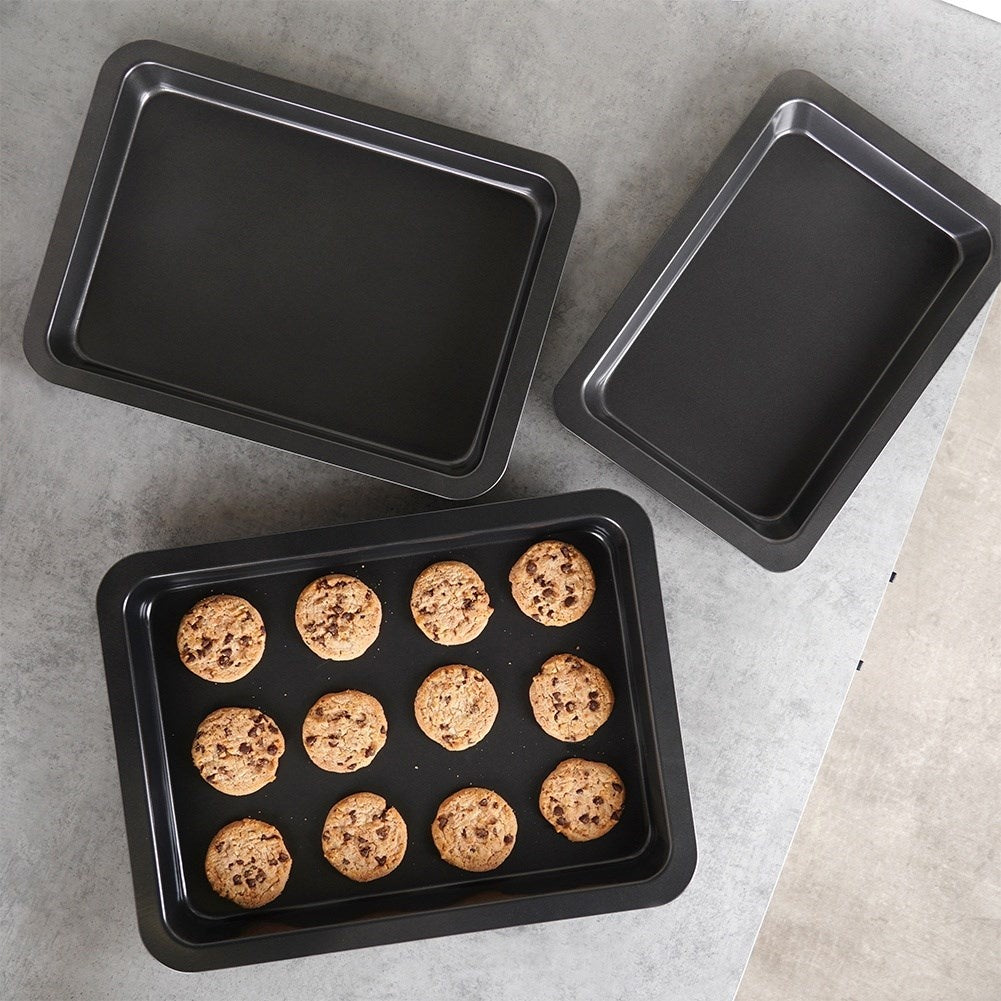 Three rectangular baking trays with non-stick coating