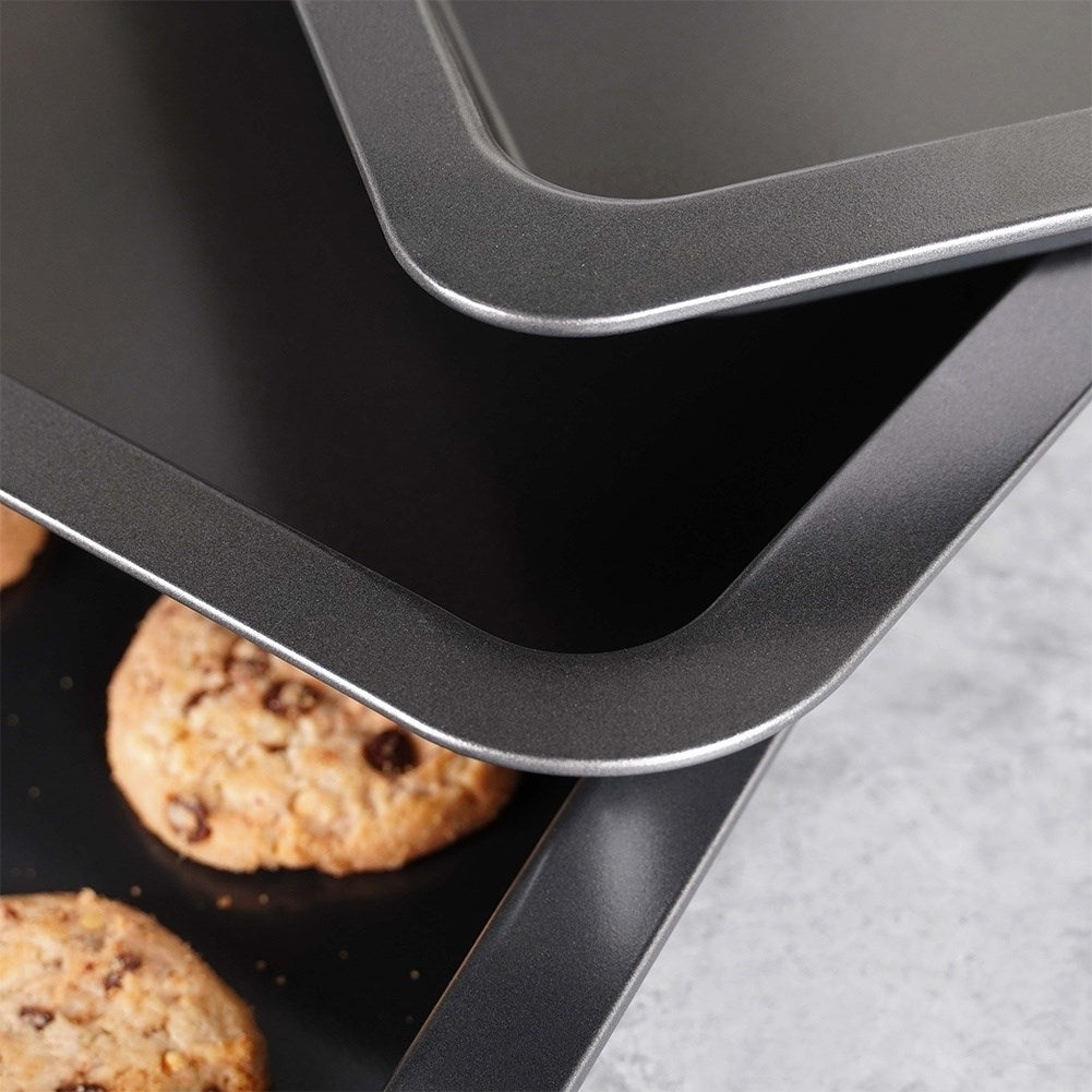 Three rectangular baking trays with non-stick coating