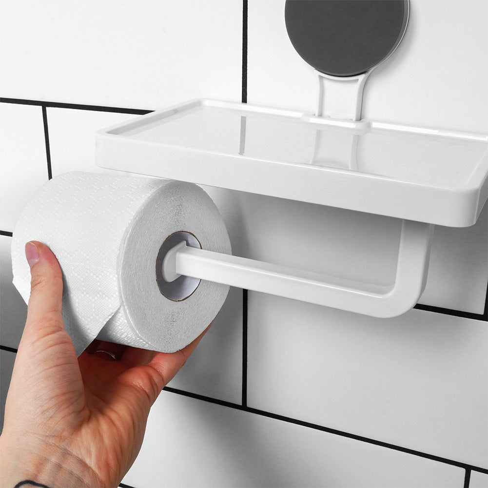 Toilet paper holder with suction cup shelf
