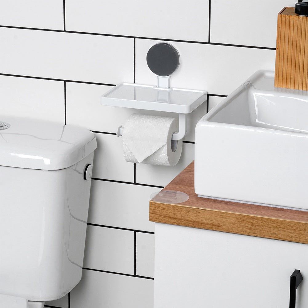 Toilet paper holder with suction cup shelf