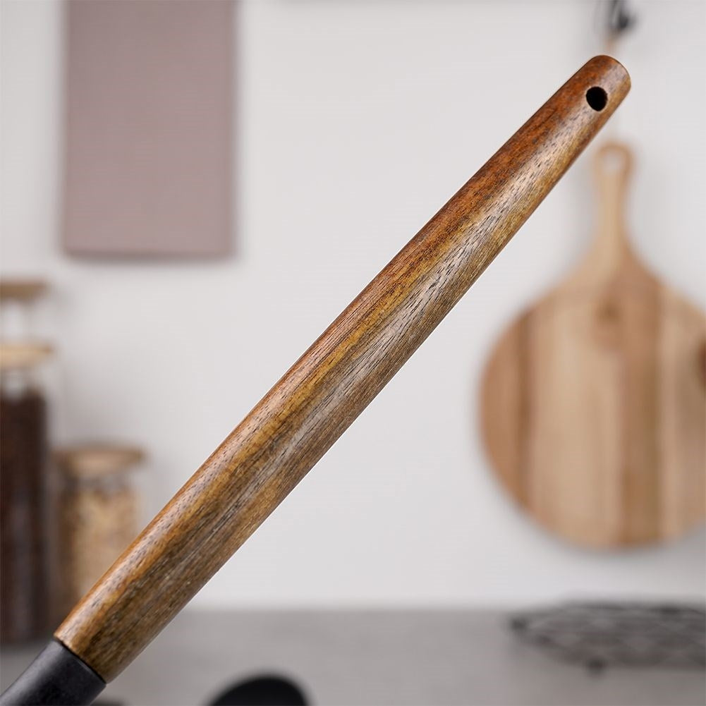 Traditional kitchen ladle in acacia wood and thermoplastic material