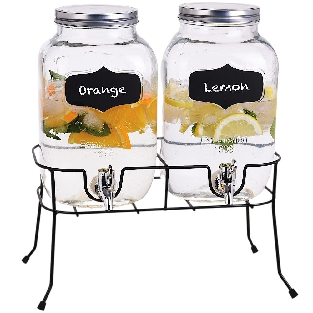 Two beverage containers with taps and metal lids on racks