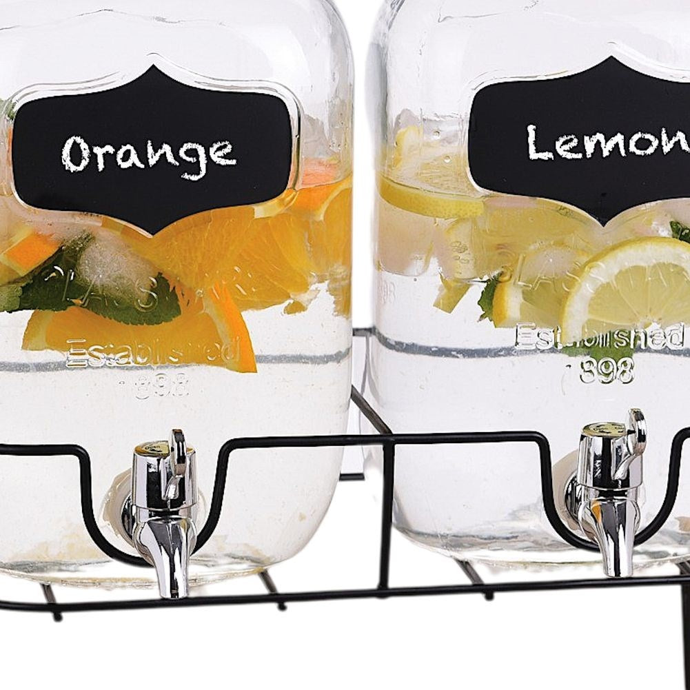 Two beverage containers with taps and metal lids on racks