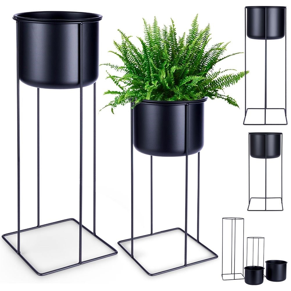 Two black metal pots with stands, different sizes