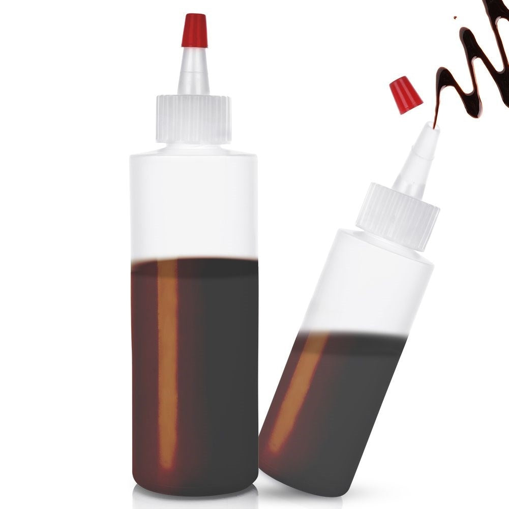 Two bottles for cake decoration, sauce dosage with lid