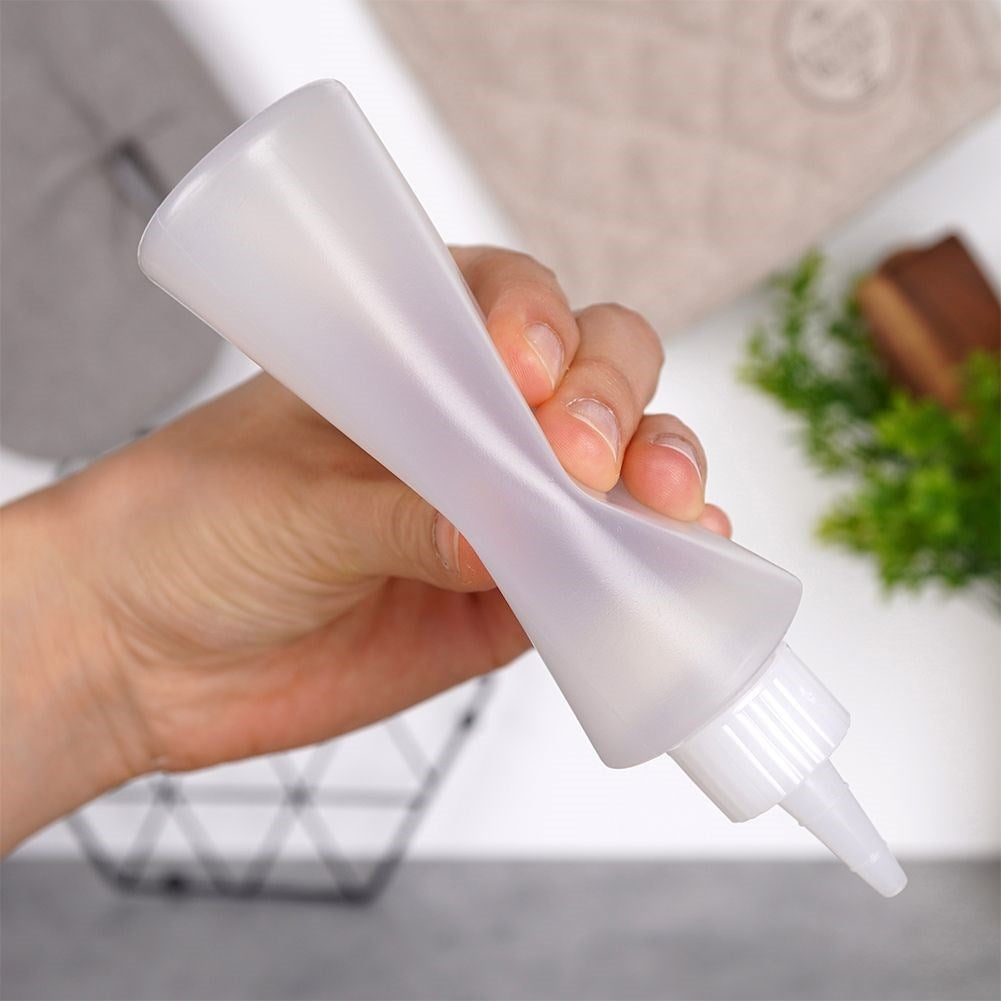 Two bottles for cake decoration, sauce dosage with lid