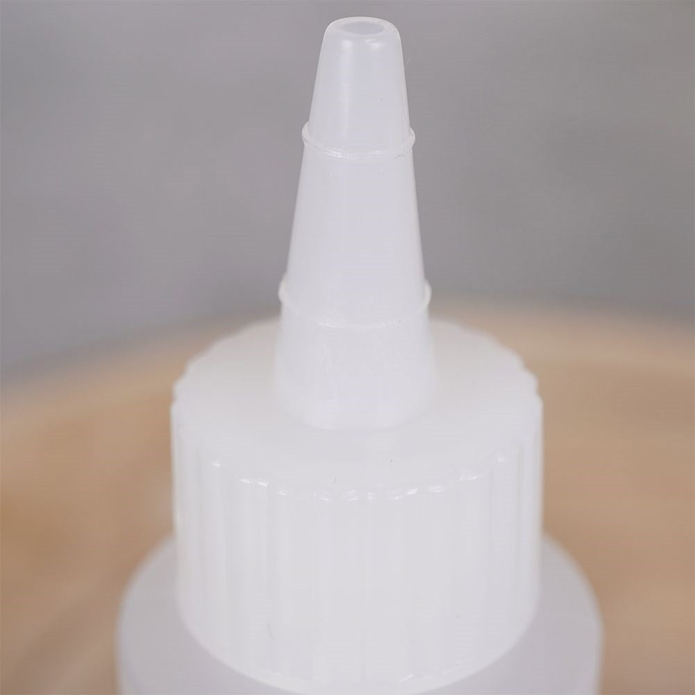 Two bottles for cake decoration, sauce dosage with lid