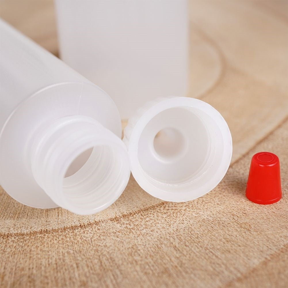 Two bottles for cake decoration, sauce dosage with lid