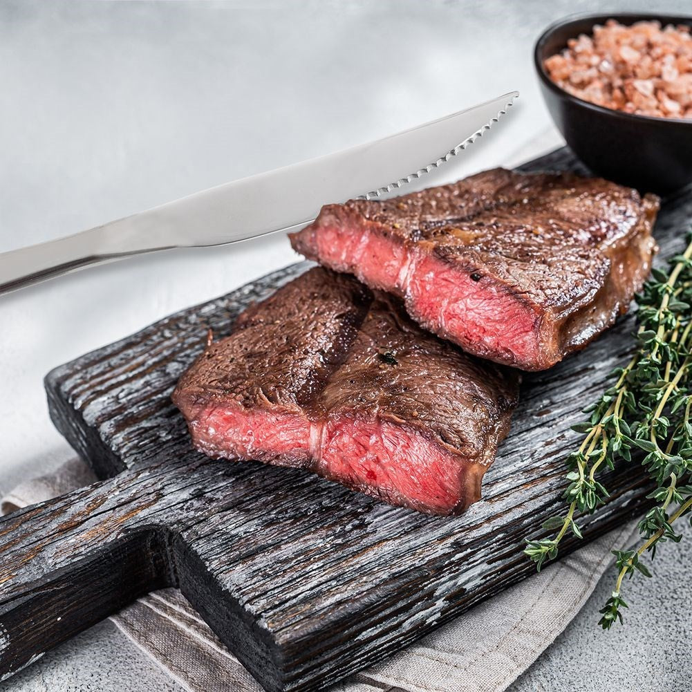 Two serrated stainless steel knives for pizza and steaks