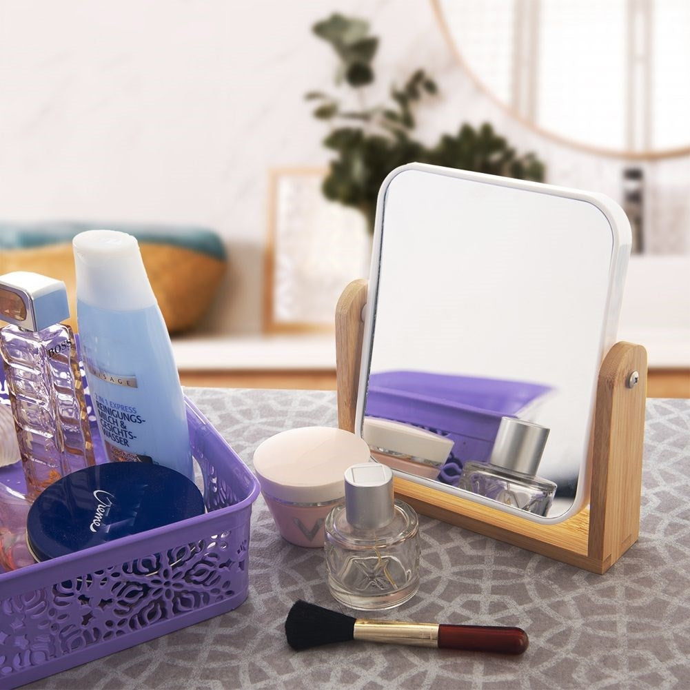 Two-sided mirror on bamboo stand with magnifying function