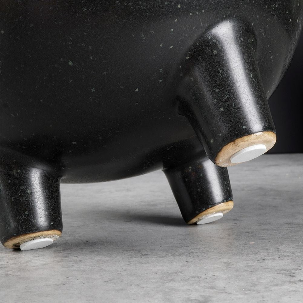 Unique black ceramic pot with legs and dots - stylish design