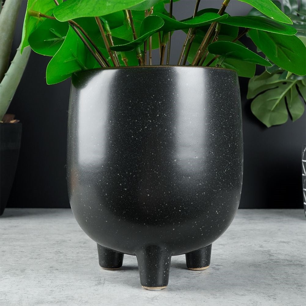 Unique black ceramic pot with legs and dots - stylish design