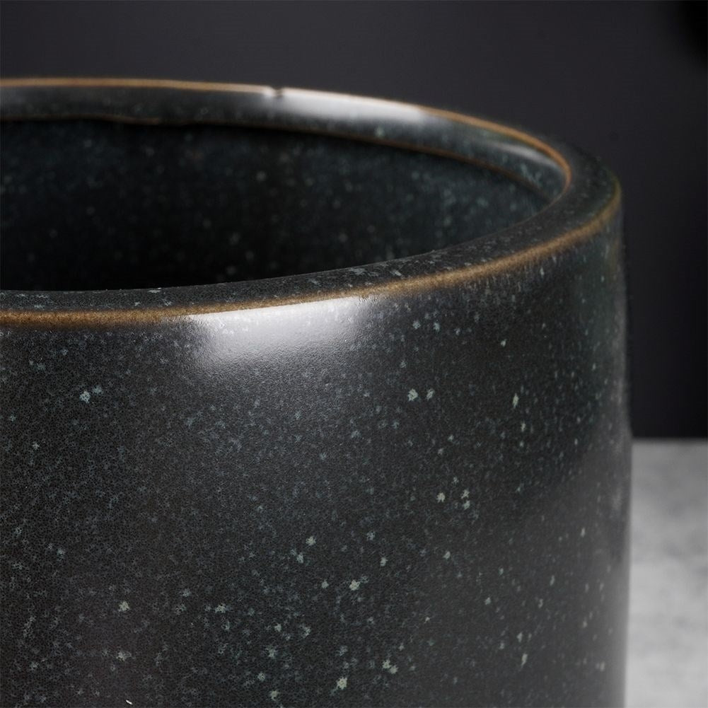Unique black ceramic pot with legs and dots - stylish design
