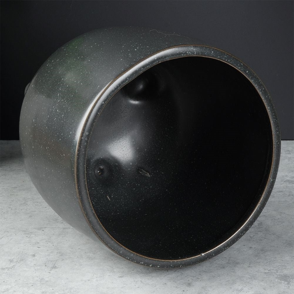 Unique black ceramic pot with legs and dots - stylish design