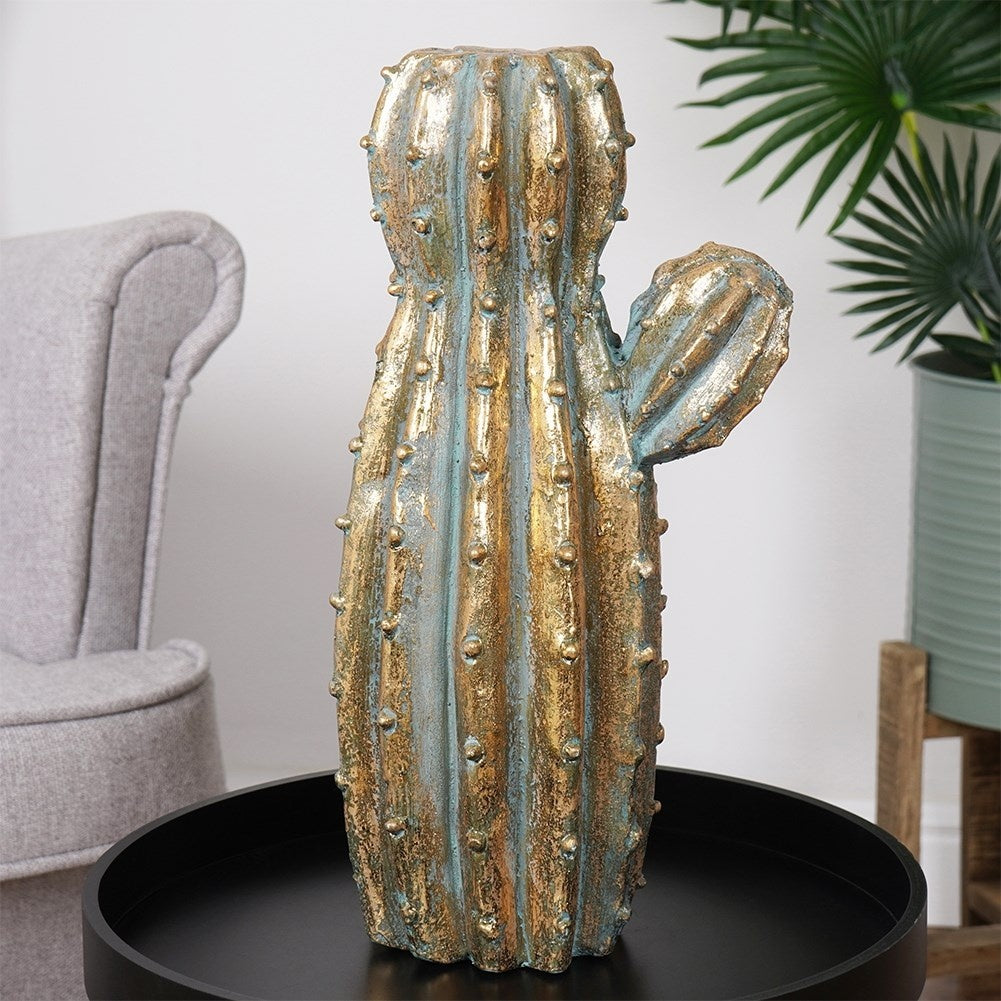 Unique flower pot in golden cactus shape made of cement