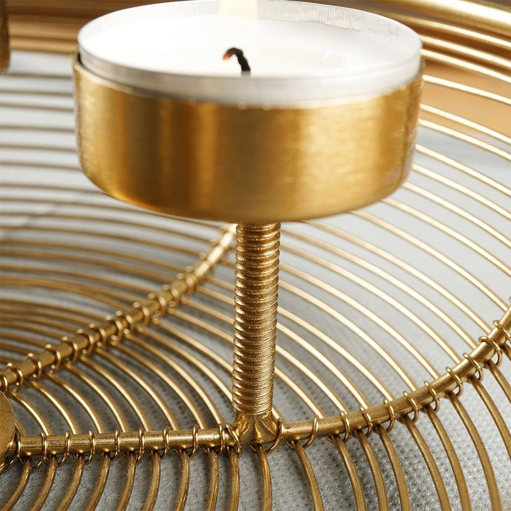 Unique golden candlestick for four bowl-shaped tealights