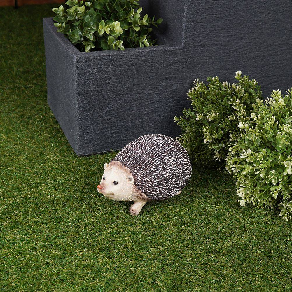 Unique hedgehog figure in synthetic stone for garden