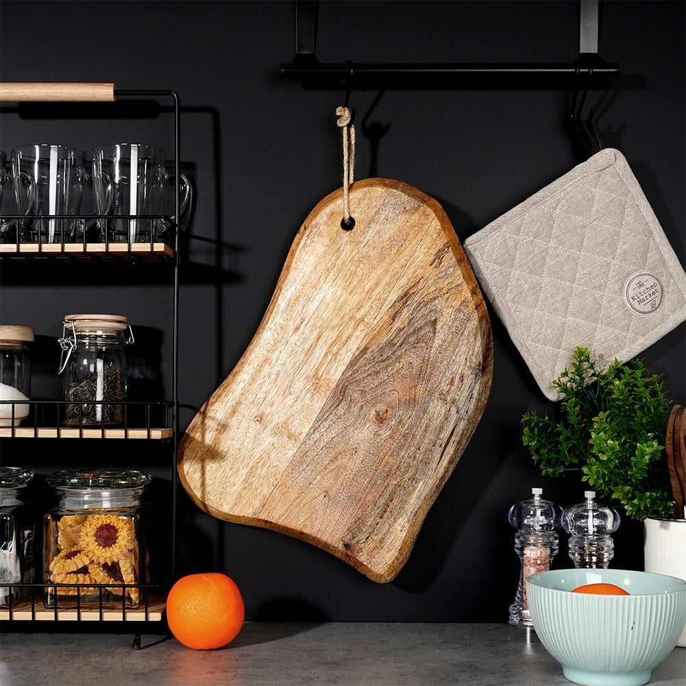 Unique kitchen board in aged mango wood for cutting and serving