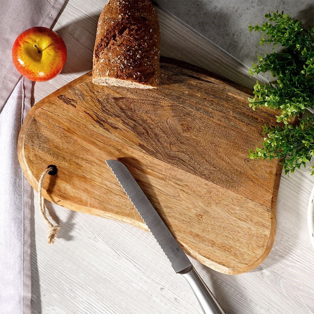 Unique kitchen board in aged mango wood for cutting and serving