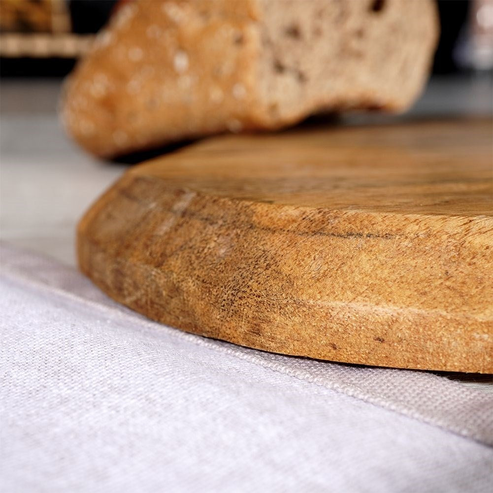 Unique kitchen board in aged mango wood for cutting and serving