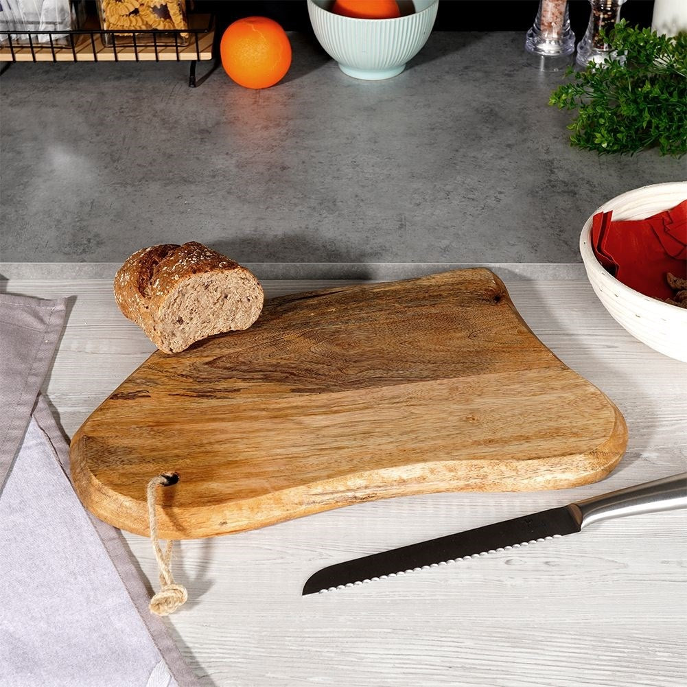 Unique kitchen board in aged mango wood for cutting and serving