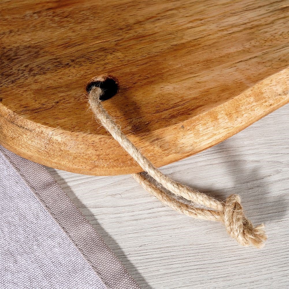 Unique kitchen board in aged mango wood for cutting and serving